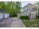 View of the house and detached two-car garage at 9801 Kent Village Dr, Charlotte, NC 28269