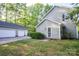 A large two-door garage complements the traditional-style home, providing ample space at 9801 Kent Village Dr, Charlotte, NC 28269
