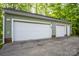 Large garage with two bays, with good lighting at 9801 Kent Village Dr, Charlotte, NC 28269