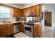 Bright kitchen featuring stainless steel appliances and ample cabinet space at 9801 Kent Village Dr, Charlotte, NC 28269