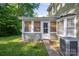 Enclosed sun room with lots of windows at 9801 Kent Village Dr, Charlotte, NC 28269