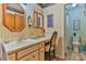 A well-lit bathroom offers a vanity area, a decorative mirror, and a toilet in an adjacent room at 1009 Catawba Valley Se Blvd, Hickory, NC 28602
