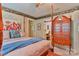 A bedroom features an ornate four-poster bed, striped wallpaper, and an ensuite vanity at 1009 Catawba Valley Se Blvd, Hickory, NC 28602