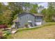 A charming home features a well-manicured lawn, mature trees, and a side-entry garage at 1009 Catawba Valley Se Blvd, Hickory, NC 28602