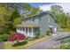 This lovely home features a cozy front porch, a side deck, and a well-maintained driveway at 1009 Catawba Valley Se Blvd, Hickory, NC 28602