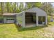 A detached outbuilding features a large open bay and a garage with roll up door at 1009 Catawba Valley Se Blvd, Hickory, NC 28602