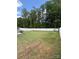 Expansive backyard featuring a lush lawn and a white privacy fence, offering ample space at 104 Trellis Ln, Troutman, NC 28166