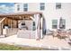 A charming backyard patio featuring a built-in kitchen and dining area, perfect for outdoor entertaining and relaxation at 104 Trellis Ln, Troutman, NC 28166
