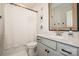 Clean bathroom with white cabinets, granite countertop, framed mirror, and shower with curtain at 104 Trellis Ln, Troutman, NC 28166