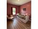 Cozy bedroom with sleek floors, daybed with storage drawers, and a comfortable reading chair at 104 Trellis Ln, Troutman, NC 28166