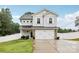 Charming two-story home with a spacious driveway and attached two-car garage at 104 Trellis Ln, Troutman, NC 28166