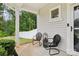 Inviting front porch with seating area and decorative lantern at 104 Trellis Ln, Troutman, NC 28166