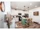 Well-lit kitchen featuring white cabinets, stainless steel appliances, an island with bar seating, and modern lighting at 104 Trellis Ln, Troutman, NC 28166