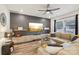 Stylish living room with entertainment center, hardwood floors, and a large sectional at 104 Trellis Ln, Troutman, NC 28166