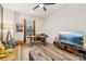 Inviting living room featuring natural light, hardwood floors, ceiling fan and comfortable seating at 104 Trellis Ln, Troutman, NC 28166