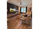 Inviting living room featuring a comfortable sectional sofa and stylish decor on a dark accent wall at 104 Trellis Ln, Troutman, NC 28166