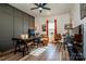 A versatile office with a seating area, modern desk, and ample lighting, creating a productive workspace at 104 Trellis Ln, Troutman, NC 28166