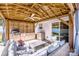 Inviting covered patio featuring a built-in outdoor kitchen and comfortable seating area at 104 Trellis Ln, Troutman, NC 28166