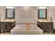 Bathroom with soaking tub, double vanity and decorative architectural features at 10501 Stonemede Ln, Matthews, NC 28105