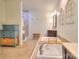 Bathroom featuring large soaking tub with decorative architectural features, walk-in shower, and vanity at 10501 Stonemede Ln, Matthews, NC 28105