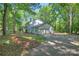 Exterior view of home featuring a lush green lawn and a two car garage at 10501 Stonemede Ln, Matthews, NC 28105