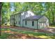 Exterior view of home featuring a lush green lawn and a two car garage at 10501 Stonemede Ln, Matthews, NC 28105