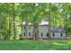 Exterior view of home featuring a lush green lawn and a two car garage at 10501 Stonemede Ln, Matthews, NC 28105