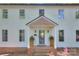 Front entrance of the home with brick steps and potted plants at 10501 Stonemede Ln, Matthews, NC 28105