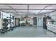 Spacious garage area featuring workout equipment and ample storage at 10501 Stonemede Ln, Matthews, NC 28105