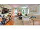 Bright living room with hardwood floors, a comfortable sectional, and lots of natural light at 10501 Stonemede Ln, Matthews, NC 28105