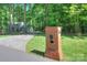 A lovely brick mailbox at the entrance to the home's long driveway at 10501 Stonemede Ln, Matthews, NC 28105