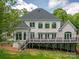 Back exterior features a deck perfect for entertaining and a lush green yard at 110 Cramer Mountain Woods None, Cramerton, NC 28032