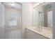 Bright bathroom featuring a vanity with a marble countertop and a large mirror at 110 Cramer Mountain Woods None, Cramerton, NC 28032