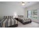 Bedroom featuring two twin beds, carpet, ceiling fan, and natural light at 110 Cramer Mountain Woods None, Cramerton, NC 28032