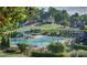 Community pool and playground surrounded by lush greenery and mature trees at 110 Cramer Mountain Woods None, Cramerton, NC 28032