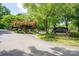 Landscaped entrance to a residential community with stone features at 110 Cramer Mountain Woods None, Cramerton, NC 28032