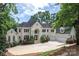 Beautiful home with manicured landscaping, a circular driveway, and a grand entrance framed by elegant columns at 110 Cramer Mountain Woods None, Cramerton, NC 28032