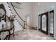 Grand foyer with a curved staircase, marble floors, and a decorative front door at 110 Cramer Mountain Woods None, Cramerton, NC 28032