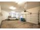 Spacious three car garage with a white car and extra storage space at 110 Cramer Mountain Woods None, Cramerton, NC 28032