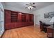 Spacious office with custom built-in bookshelves, hardwood floors, and a ceiling fan at 110 Cramer Mountain Woods None, Cramerton, NC 28032