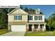 Charming two-story home with a brick and siding exterior and an attached two-car garage at 1362 Secrest Commons Dr, Monroe, NC 28112
