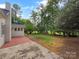 Lush backyard with patio, mature trees, and well-maintained lawn, offering a private outdoor retreat at 141 Edenvale Rd, Rock Hill, SC 29730