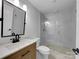 Modern bathroom with a walk-in shower, updated vanity, and contemporary fixtures at 141 Edenvale Rd, Rock Hill, SC 29730