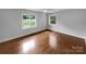 Clean room featuring hardwood floors, neutral tones, and natural light from the windows at 141 Edenvale Rd, Rock Hill, SC 29730