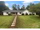 Charming, single-story home with a well-manicured lawn and inviting walkway at 141 Edenvale Rd, Rock Hill, SC 29730