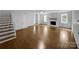 Spacious living room featuring hardwood floors, a staircase, and a fireplace at 141 Edenvale Rd, Rock Hill, SC 29730
