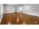Spacious room featuring gleaming hardwood floors and a neutral color palette at 141 Edenvale Rd, Rock Hill, SC 29730