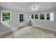 Bright living room with multiple windows and a door to the backyard at 141 Edenvale Rd, Rock Hill, SC 29730