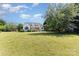 A expansive, green backyard behind the home, offers a sense of serenity and connection to nature at 14807 Middlesborough Dr, Matthews, NC 28104