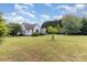 A wide, well-maintained yard provides a beautiful backdrop to the home's exterior at 14807 Middlesborough Dr, Matthews, NC 28104